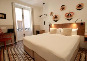 Postel nebo postele na pokoji v ubytování VALOLA Boutique Rooms