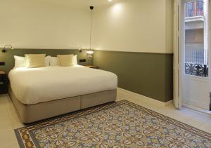 Postel nebo postele na pokoji v ubytování VALOLA Boutique Rooms