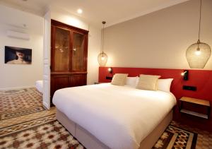 Postel nebo postele na pokoji v ubytování VALOLA Boutique Rooms
