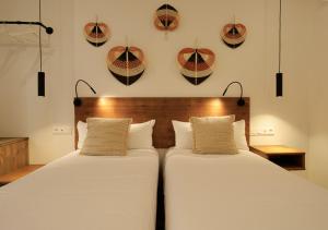 Postel nebo postele na pokoji v ubytování VALOLA Boutique Rooms
