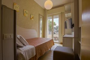 Postel nebo postele na pokoji v ubytování Hotel Ombretta Mare + 36 fotografií