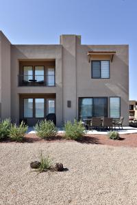 a house with a bench in front of it at Luxury At The Ledges in St. George