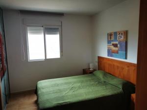 Postel nebo postele na pokoji v ubytování Apartamento familiar cerca playa con bandera azul