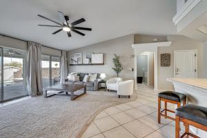 a living room with a couch and a table at Inviting Home with Lake View 2 Mi to Lake Havasu! in Lake Havasu City