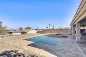 a swimming pool in the backyard of a house at Inviting Home with Lake View 2 Mi to Lake Havasu! in Lake Havasu City