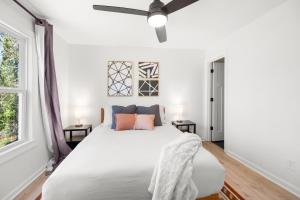 a bedroom with a white bed and a window at Smart Home in Heart of Snellville in Snellville