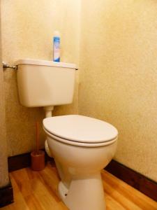 a bathroom with a toilet with a bottle of toothpaste on it at Résidence Bionnassay - Bionnassay B159 MAE-5357 in Les Contamines-Montjoie +4 photos