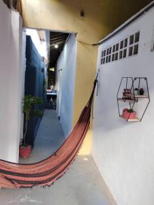 a hammock in a hallway of a building at Espaço Completo Privativo - Aconchego Olinda Alta in Olinda