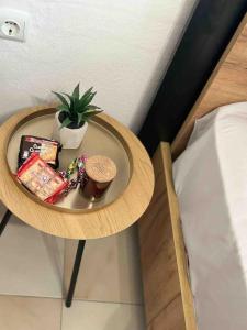 a plate of food on a table next to a bed at Central Square Studio in Xanthi
