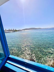 a view of the ocean from a window of a boat at mills suites mykonos in Mikonos