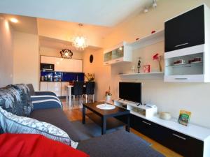 a living room with a couch and a table at Apartament Pod Giewontem in Zakopane