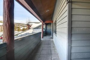 an outside walkway of a house with a window at Downtown Winter Park Condo with Free Bus to Ski Base in Winter Park