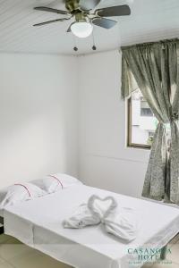 Uma cama ou camas num quarto em CASANOVA HOTEL