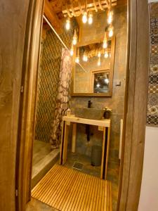 a bathroom with a sink and a mirror at Hermannstadt House in Sibiu +148 photos