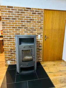 a brick fireplace in a room with a brick wall at Heart of Celle in Celle