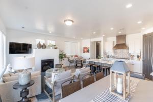 a kitchen and living room with a table and chairs at Hacienda Hideaway in St. George