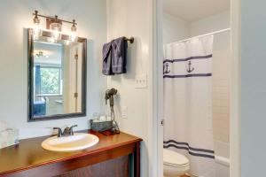a bathroom with a sink and a toilet and a mirror at Bells Marina & Fishing Resort - Santee Lake Marion by I95 - Family Adventure, Pets on Request! in Eutawville +87 photos