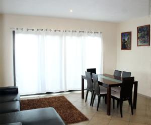 a dining room with a table and chairs at BILBAO in Chiconcuac