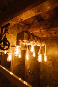 a group of lights hanging from a ceiling at Hermannstadt House in Sibiu