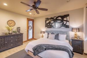 a bedroom with a bed and a ceiling fan at Chip Shot in St. George
