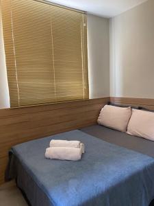 Ένα ή περισσότερα κρεβάτια σε δωμάτιο στο Apartamento Studio Completo - próximo à Savassi