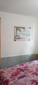a bedroom with a bed and a painting on the wall at Extra lokacija!!!!! in Sutomore