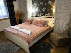 A bed or beds in a room at Bíborlak 7