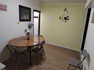 a dining room with a table and chairs at Casa del Centro 2P in Santa Caterina Villarmosa
