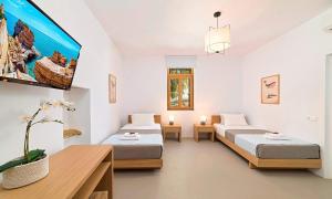 Postel nebo postele na pokoji v ubytování Sun Stone Villas