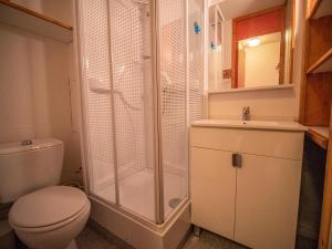 a bathroom with a shower and a toilet and a sink at PORTAIL G - Appartement PORTAIL 51 pour 2 Personnes 00 in Valmorel