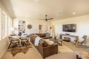 a living room with a couch and a table at Taking Flight in Ivins