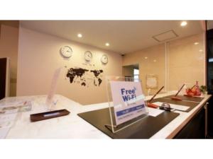 a kitchen counter with a free wifi sign on it at Fujisan Resort Hotel - Vacation STAY 57971v in Fujikawaguchiko