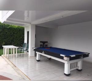 a pool table sitting on top of a patio at Finca luminosa in Pereira