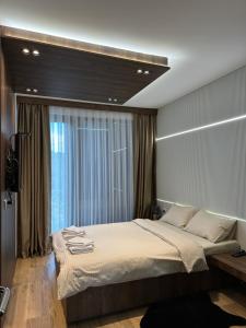Llit o llits en una habitació de BOROVI PREMIUM wellness&spa