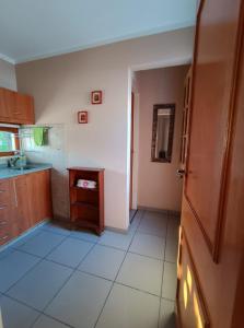 a kitchen with a sink and a counter top at Casiopea Apart in San Fernando del Valle de Catamarca