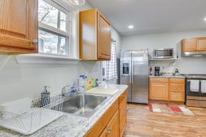 a kitchen with a sink and a refrigerator at Charming Sylvester Apartment - 17 Mi to Albany! in Sylvester