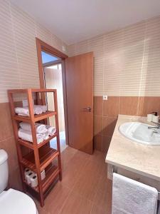 a bathroom with a sink and a toilet and a sink at Chalet Benajarafe Beach Malaga in Benajarafe +30 photos