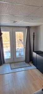 a room with two large windows in a room at Nature Retreat in the city in Ottawa