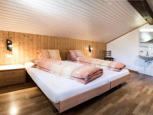 A bed or beds in a room at Apartment Wiedersehen by Interhome