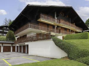 a building with balconies on the side of it at Apartment Chantebrise A2 by Interhome in Chesières