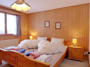 Postelja oz. postelje v sobi nastanitve Apartment Chalet Papillon by Interhome