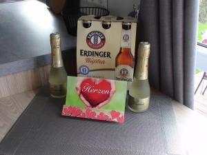 a couple of bottles of champagne and a box at Holiday Home Toni by Interhome in Wemding