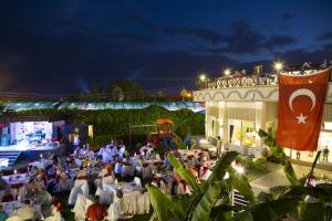 a crowd of people sitting in chairs at a event at Sun Club Side Hotel - All inclusive in Side