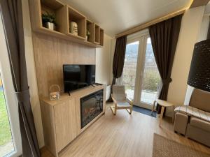 TV a/nebo společenská místnost v ubytování Holiday Home Tiny Haus Prinz Ludwig by Interhome