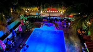 an overhead view of a pool at a resort at night at Hotel Camaleon Granada in Granada