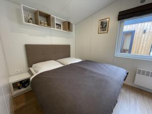 Postel nebo postele na pokoji v ubytování Holiday Home Tiny Haus Prinz Ludwig by Interhome