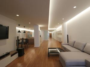 a living room with a couch and a table at Apartment Loft Villalonga by Interhome in Valencia