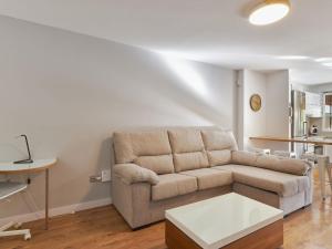 a living room with a couch and a table at Apartment Playa de la Luna by Interhome in Cabopino