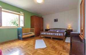 a bedroom with two beds and a crib in it at House Soul in Oklaj +32 photos