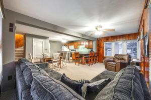 a living room with a couch and a table at Clear Lake Vacation Rental Walk to City Beach! in Clear Lake